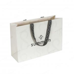 Paper bag with woven-texture handle