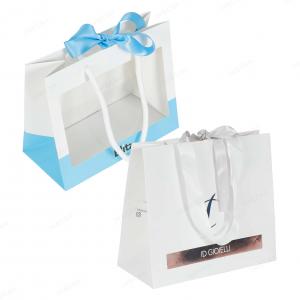 Paper bag with ribbon bow